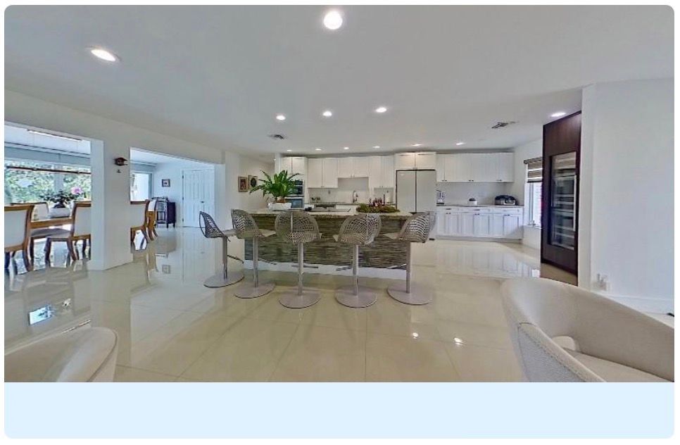 A modern architectural space featuring a series of sleek interior design images with clean white minimalist aesthetics.