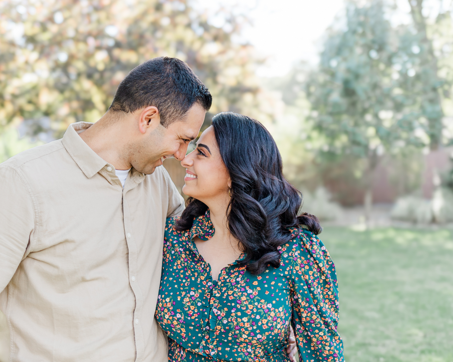 Parents with noses touching dressed in fall colors during Hudson valley family photo session
