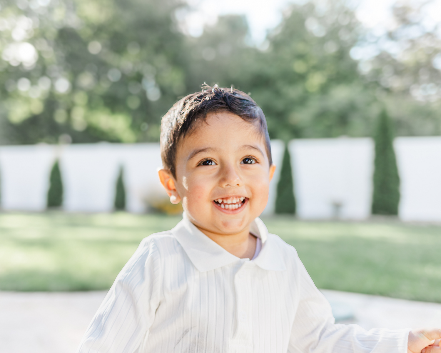 Little boy smiling with white shirt during Hudson valley family photo session