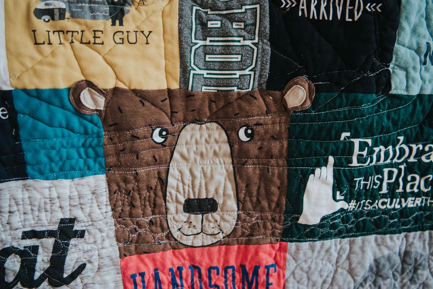 A bear face t-shirt is seen after it has been quilted into a memory quilt.