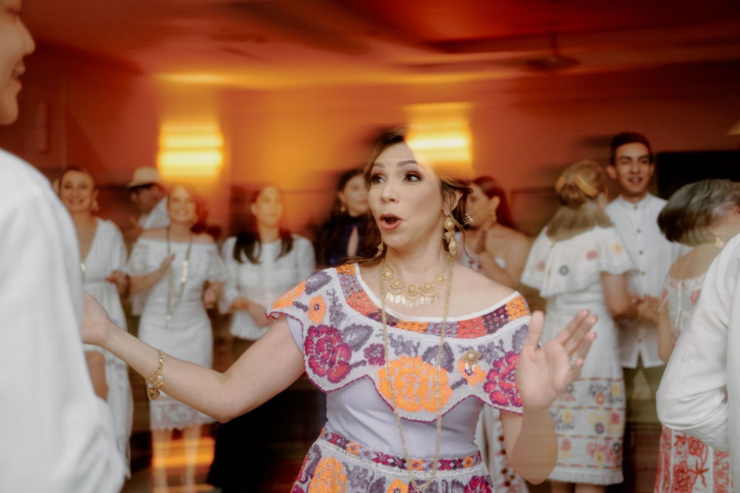 Dancers in traditional Colombian attire perform at a festive celebration.