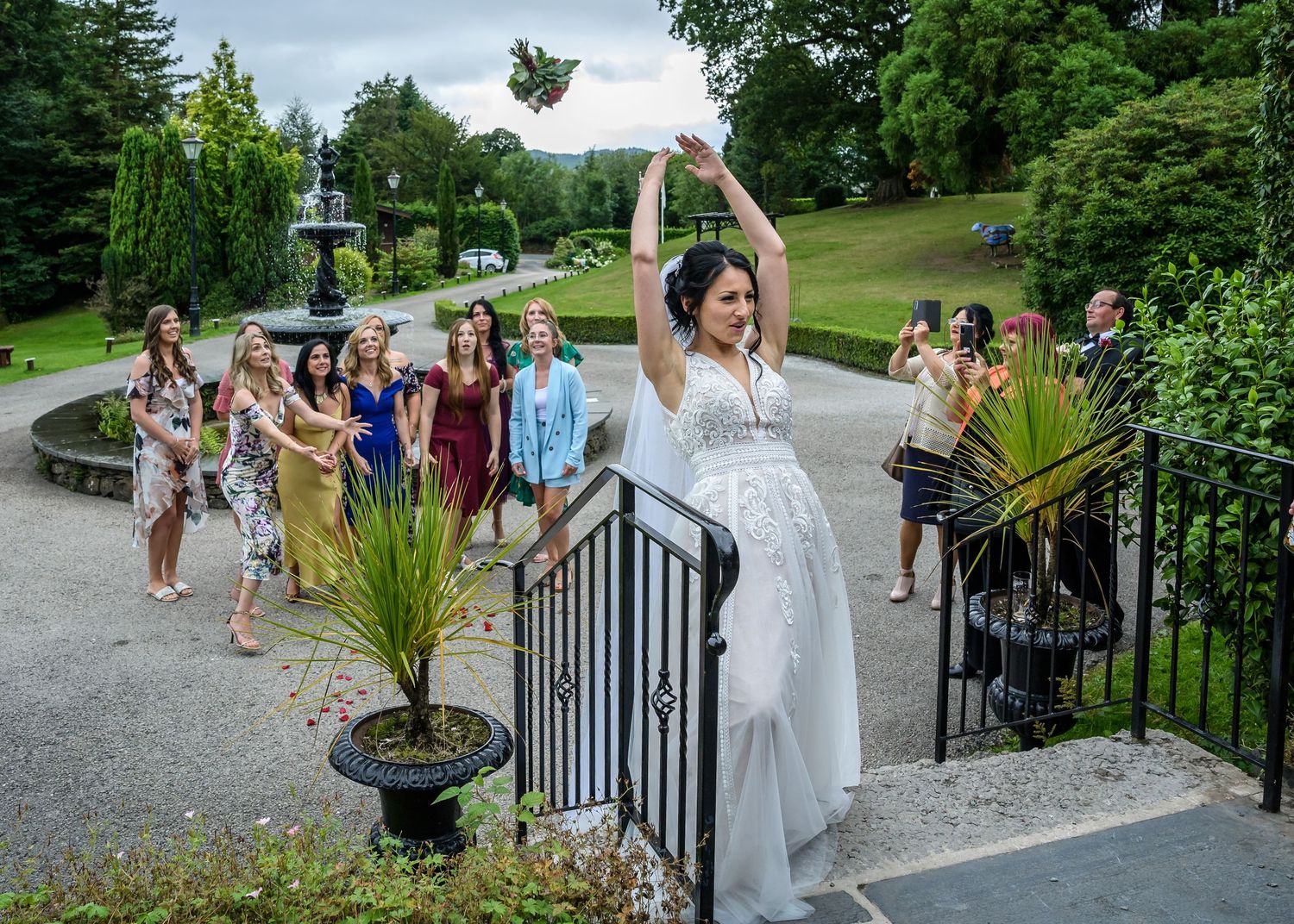 Bride throwing bouquet at Broadoaks Country House wedding