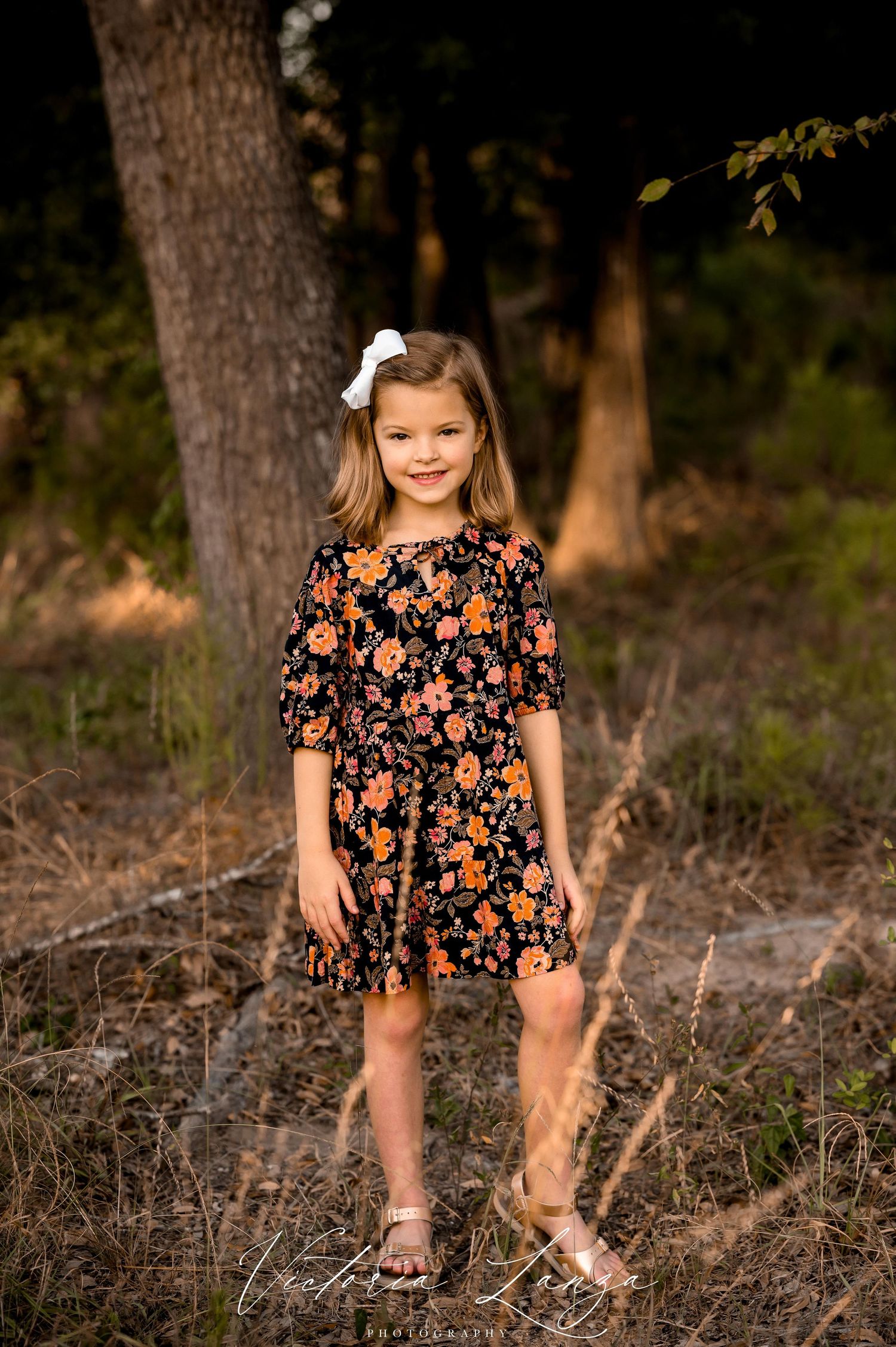 portrait of a girl in the woods during fall minis in houston texas