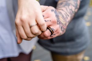Two hands showing rings