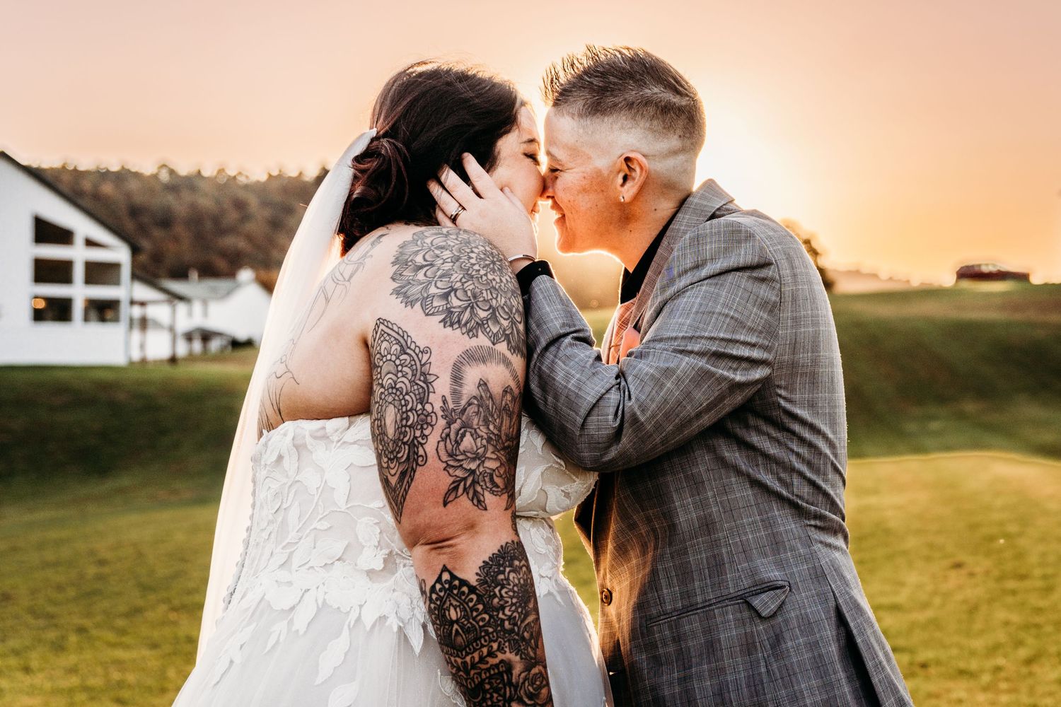 LGBTQ+ Lesbian couple share a kiss outside Bailey Barns Venue in Fairview, WV