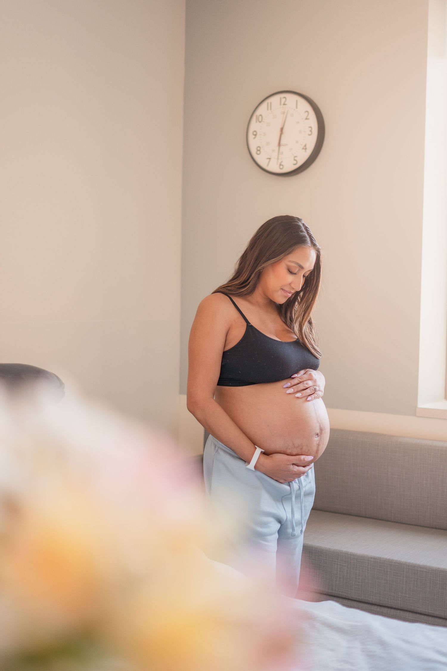 Radiant pregnant mom during a West Michigan maternity photoshoot, highlighting her beautiful journey.