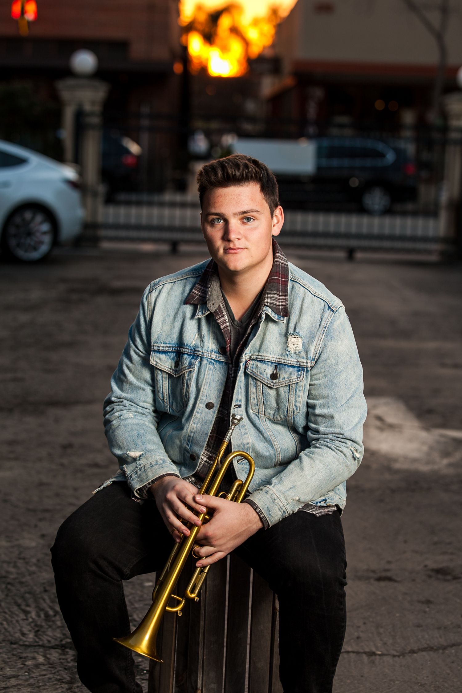 senior-boy-holding-trumpet-posing-for-grad-pics