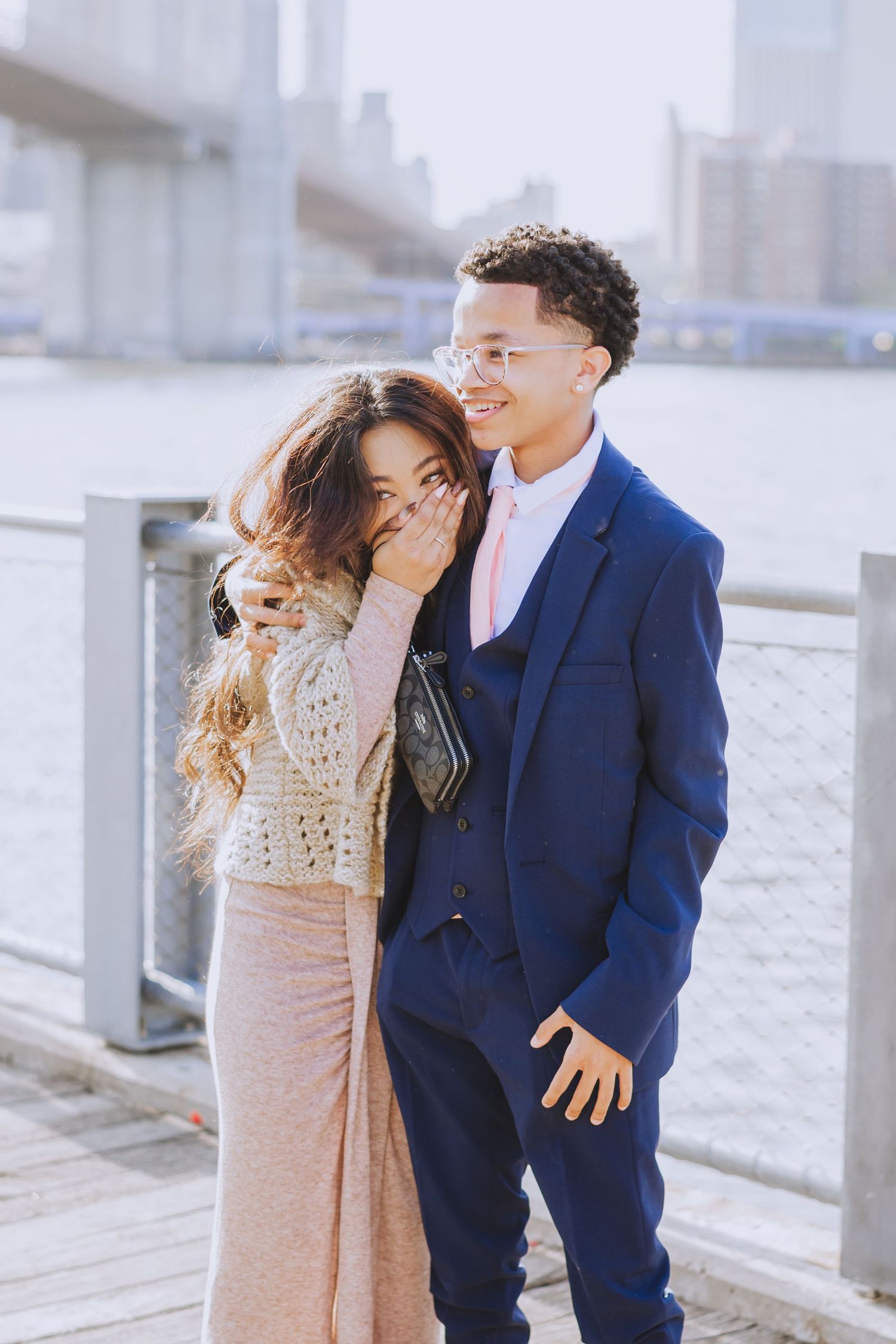 A joyful reaction captured during a romantic waterfront proposal.