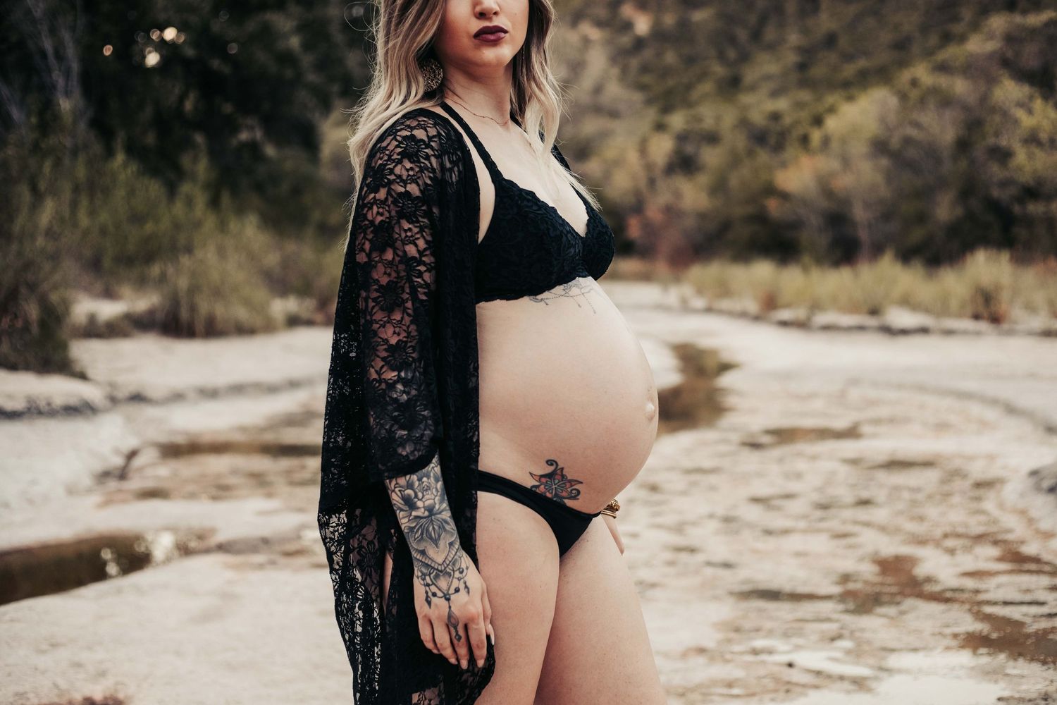 Pregnant woman's belly at a park in Austin, Texas