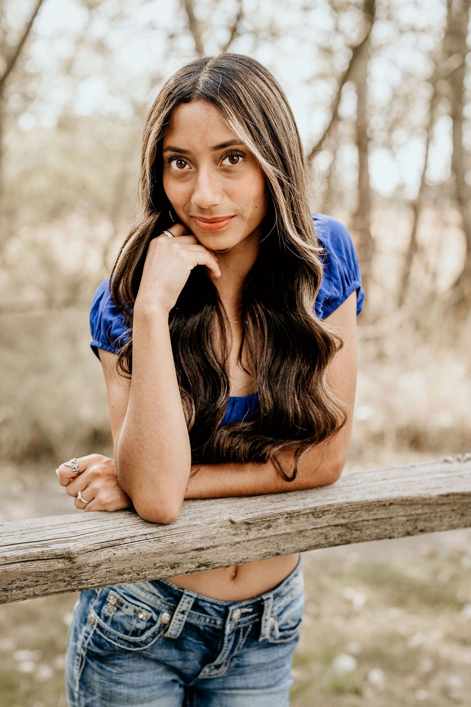 Girl leaning on a wood fence at the Whitman Mission