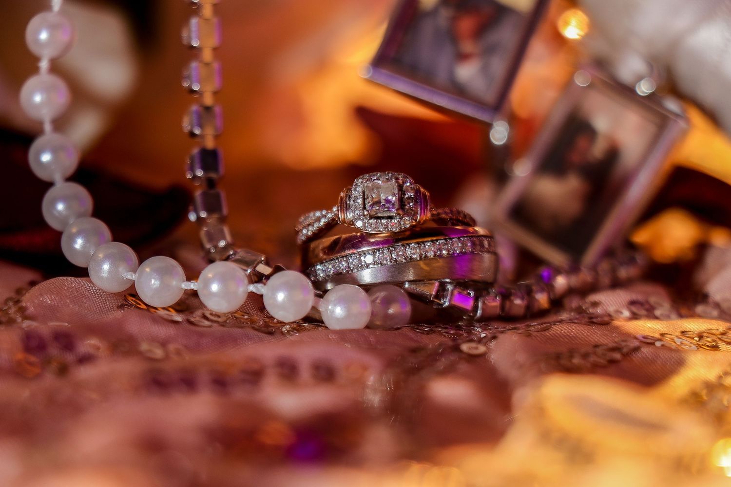 Pearl and crystal wedding accessories arranged in artistic detail shot.
