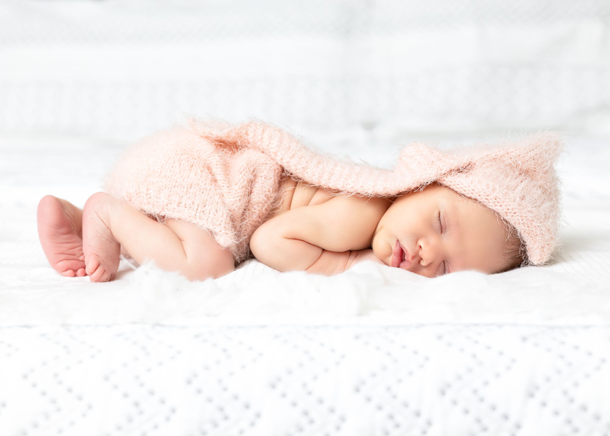 Newborn baby sleeping peacefully in a photography session by Swaff Shots.