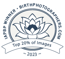 Circular logo design with decorative elements and text for birth photography.
