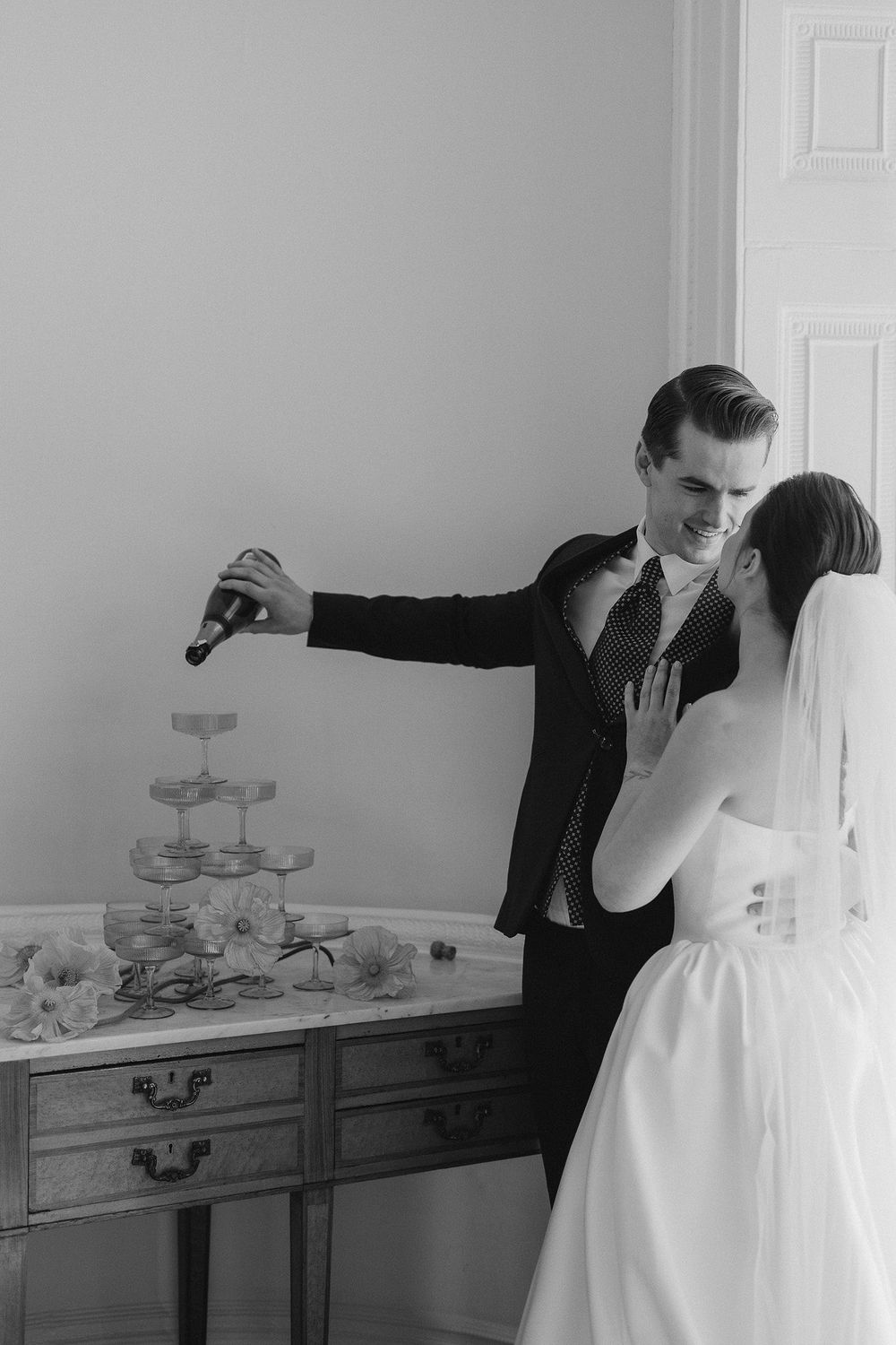 Bride and groom and their champaign tower during London wedding