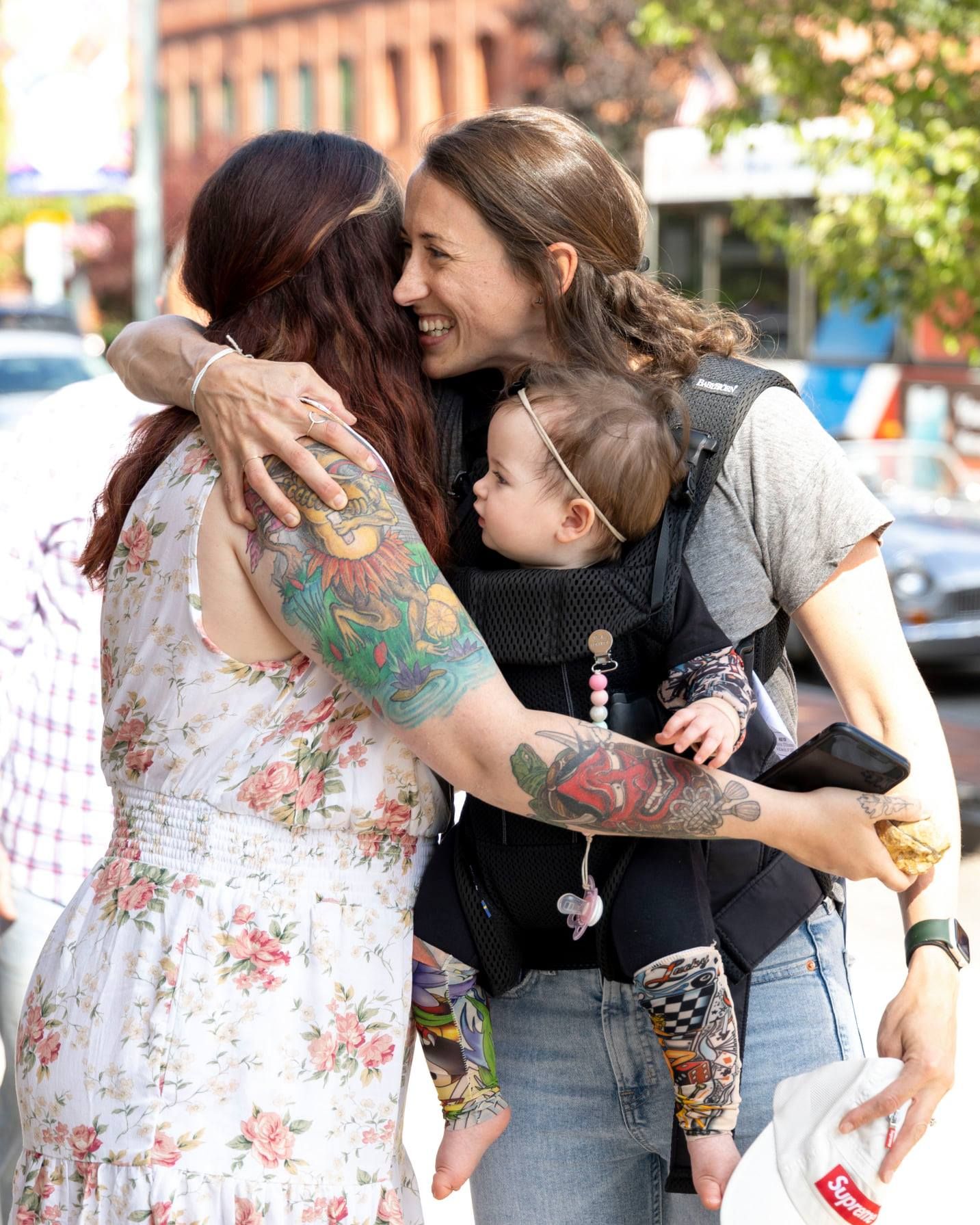 A couple shares intimate moments in a sequence of candid outdoor photos showing affection and laughter.