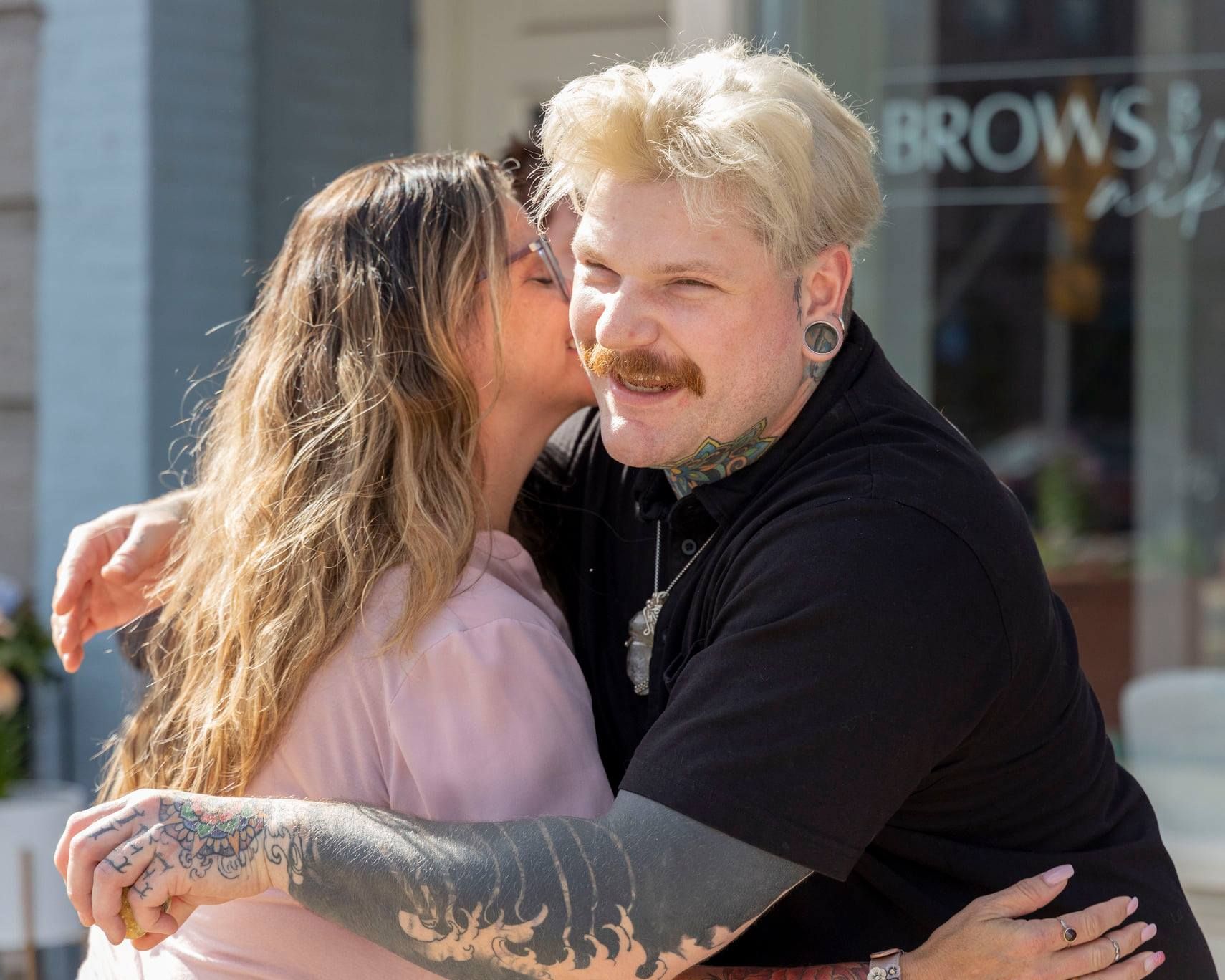 Candid moments of affection captured in a series of outdoor photos.