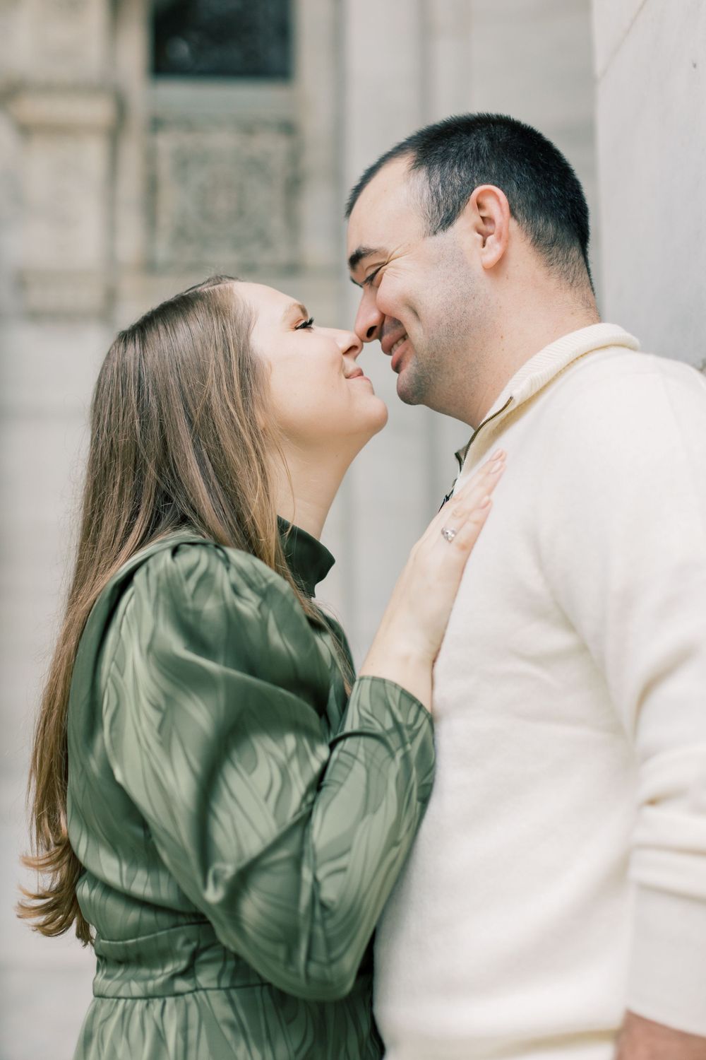 Intimate moment between couple during engagement session.