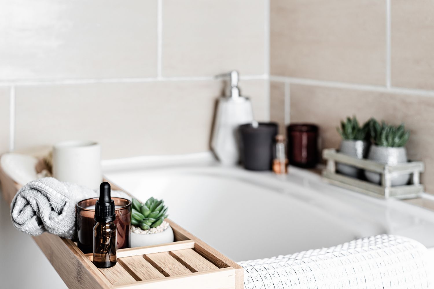 spa bath with essential oils, candles and plants, inviting airbnb photos