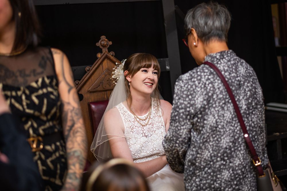 candid bride at acton town hall wedding reception