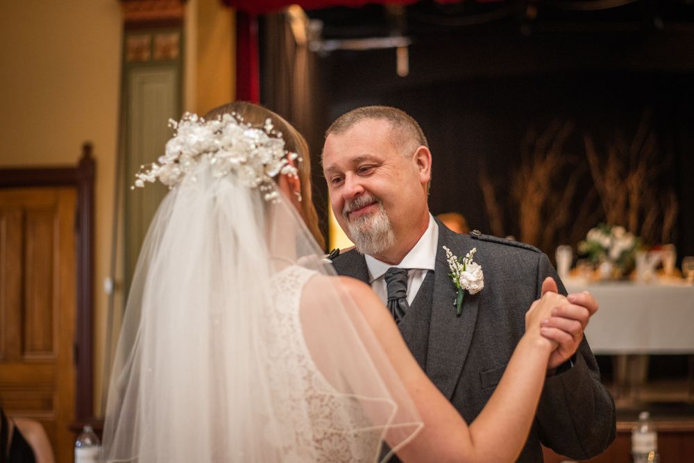 bride and father of the bride first dance close up at acton town hall wedding reception