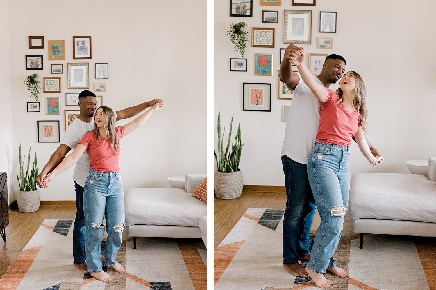 Dancing couple enjoying playful moments in their living room decorated with wall art.