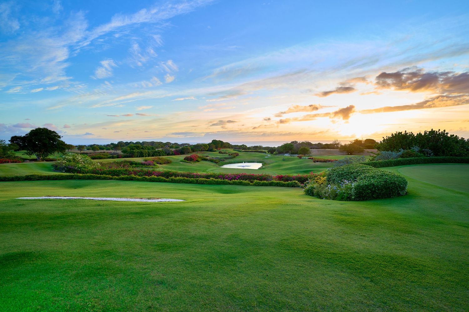 Sandy Lane golf course at sunset with lush green fairways and dramatic sky.