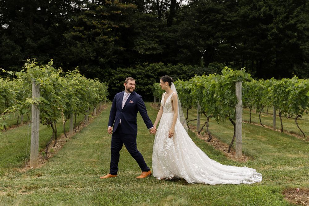 Photo of bride and groom in an orchard on their wedding day. Oakland County Michigan