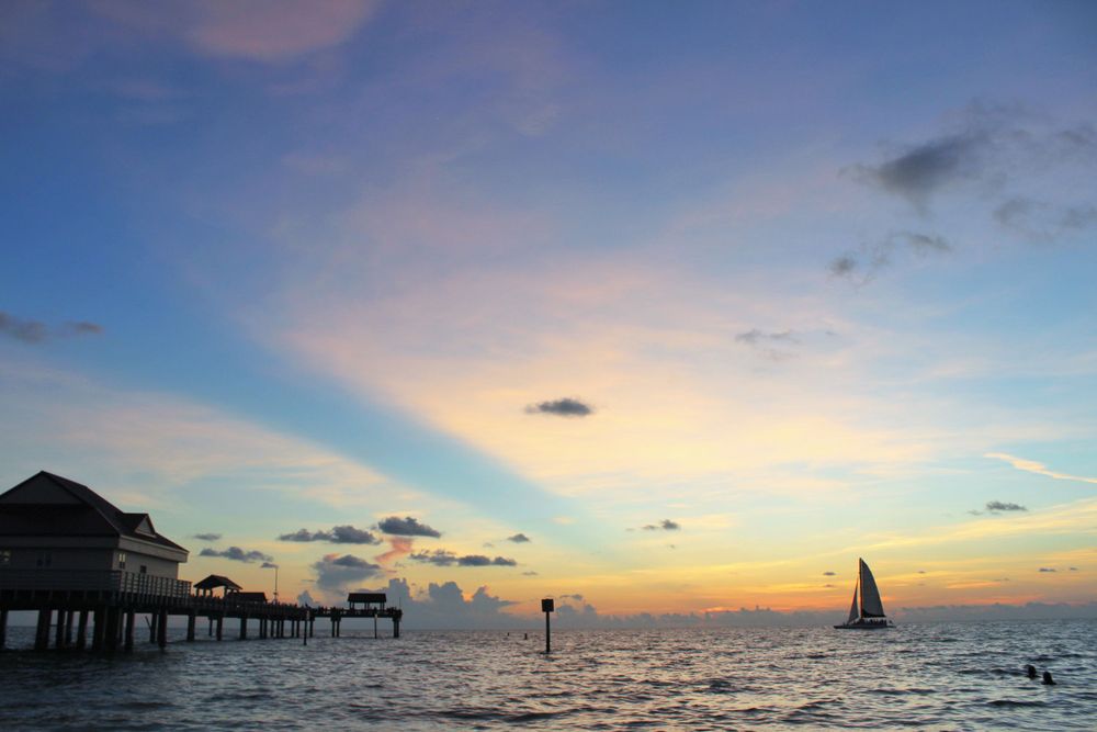 One Big, Beautiful Crepuscular Ray, A Sailboat, And A Sunset