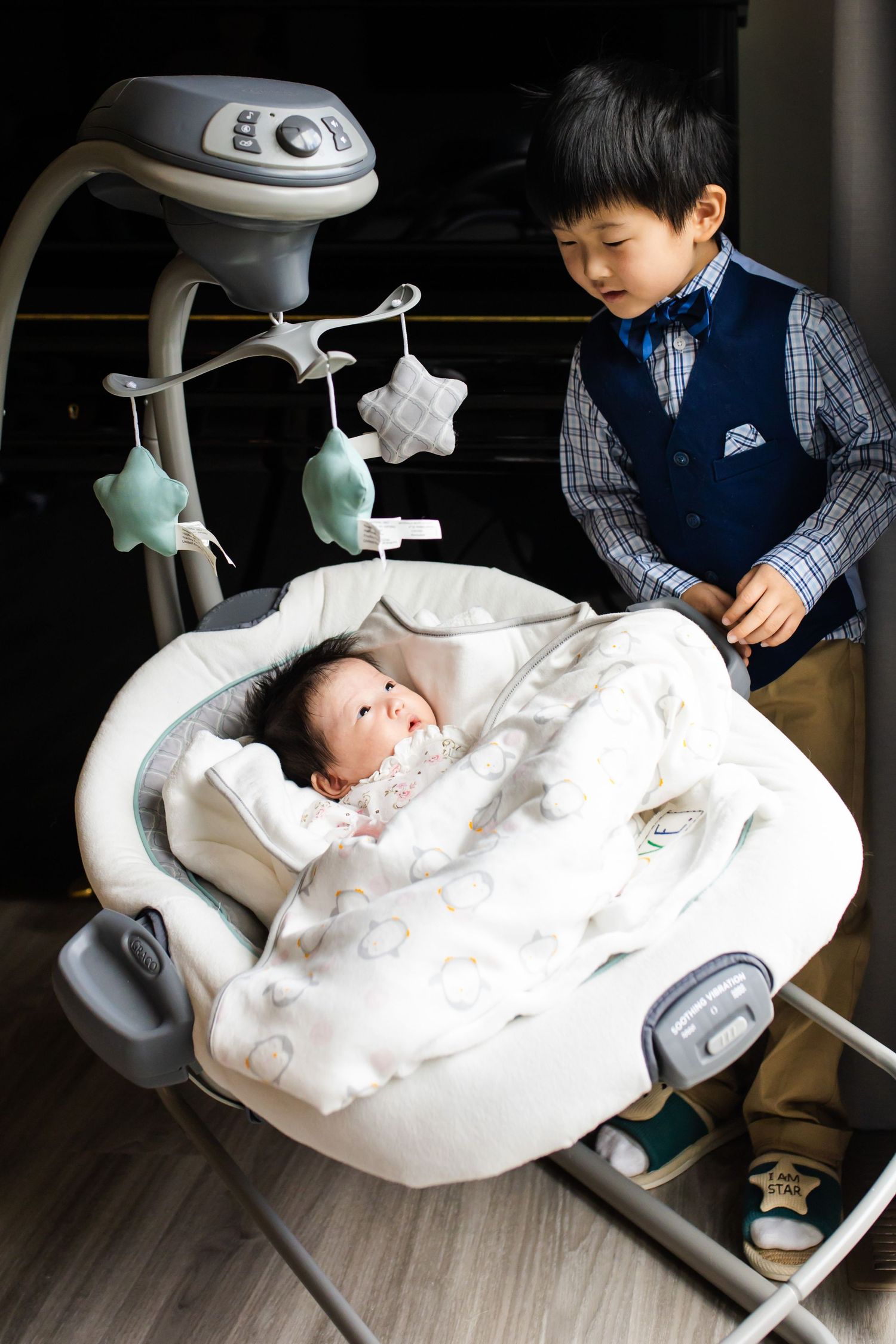 A brother looking at his baby sister in Redmond