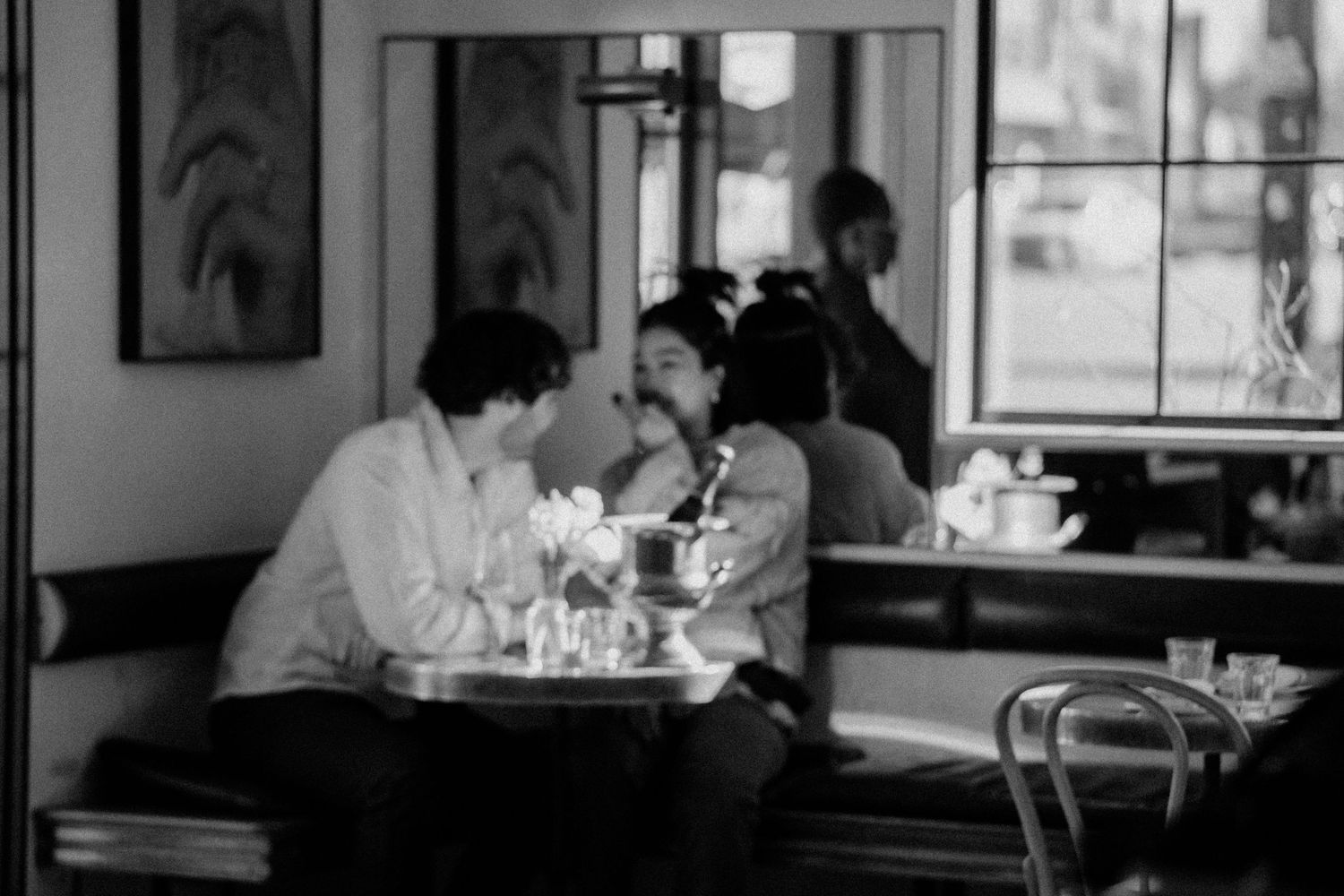Couple chats at a booth at June's All Day during a proposal