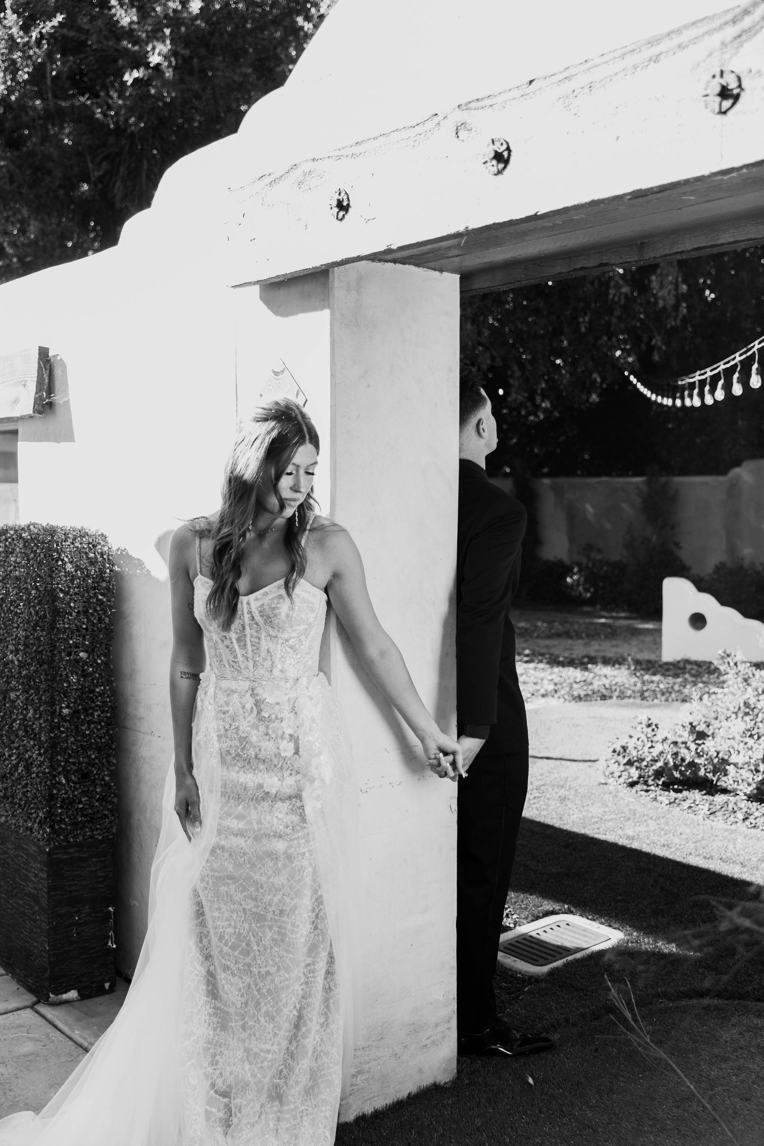 Black and white photo of the bride and groom's first look before their wedding ceremony begins.