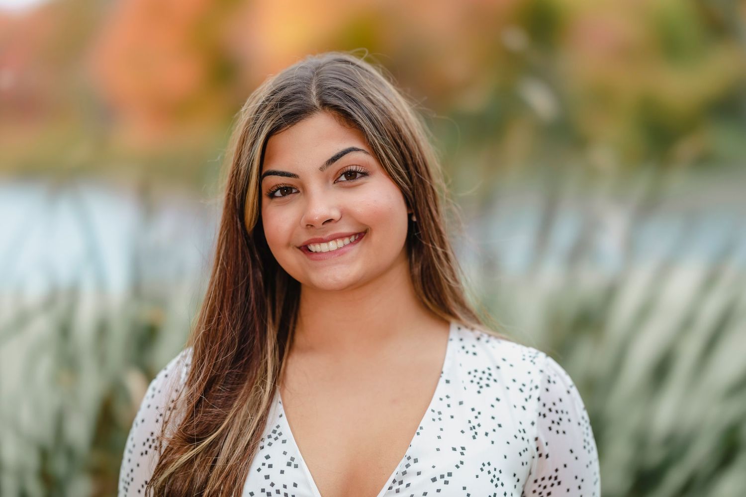Senior portrait session outdoors with autumn foliage and natural lighting in multiple poses.