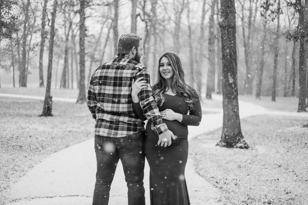 Family portrait session in a wooded park setting during autumn.