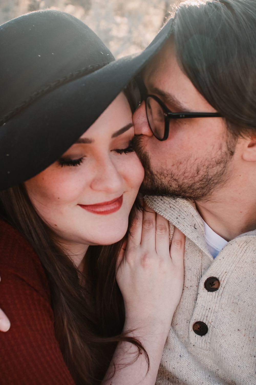 Romantic close-up series showing tender moments between a couple wearing casual winter attire.