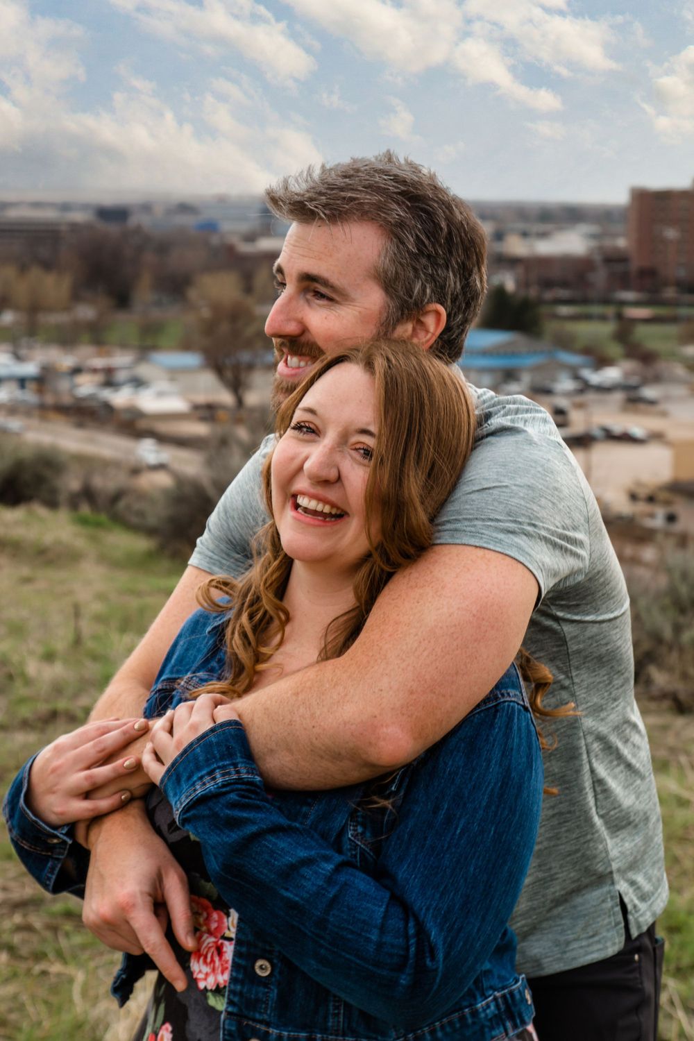 Candid outdoor photo sequence of a couple laughing and hugging against a scenic backdrop.