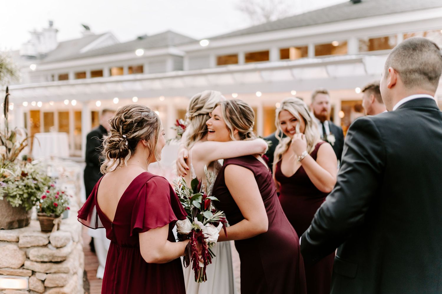 Wedding party and guests reacting emotionally during outdoor celebration.