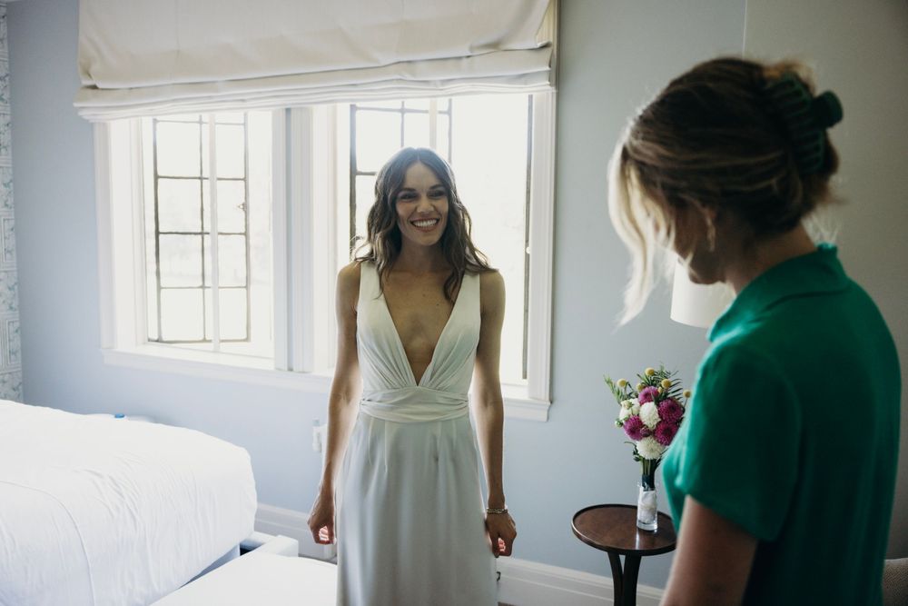 Intimate moments captured in a bright room with natural window lighting.