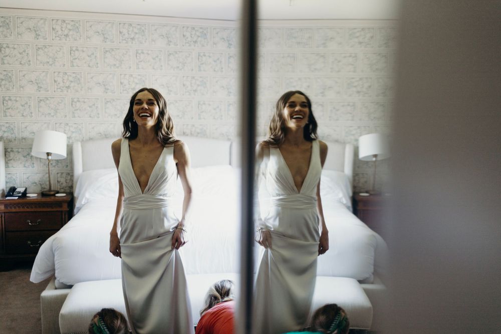 Artistic black and white photographs showing details of a white dress.