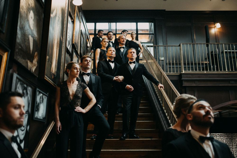 Bridal party standing on the staircase at Oxford Exchange in Tampa, Florida.