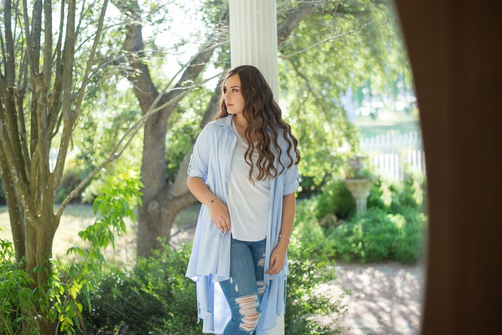 girl leaning on column for photo. Memory lane photo spot. Mission, Texas. Wedding photography
