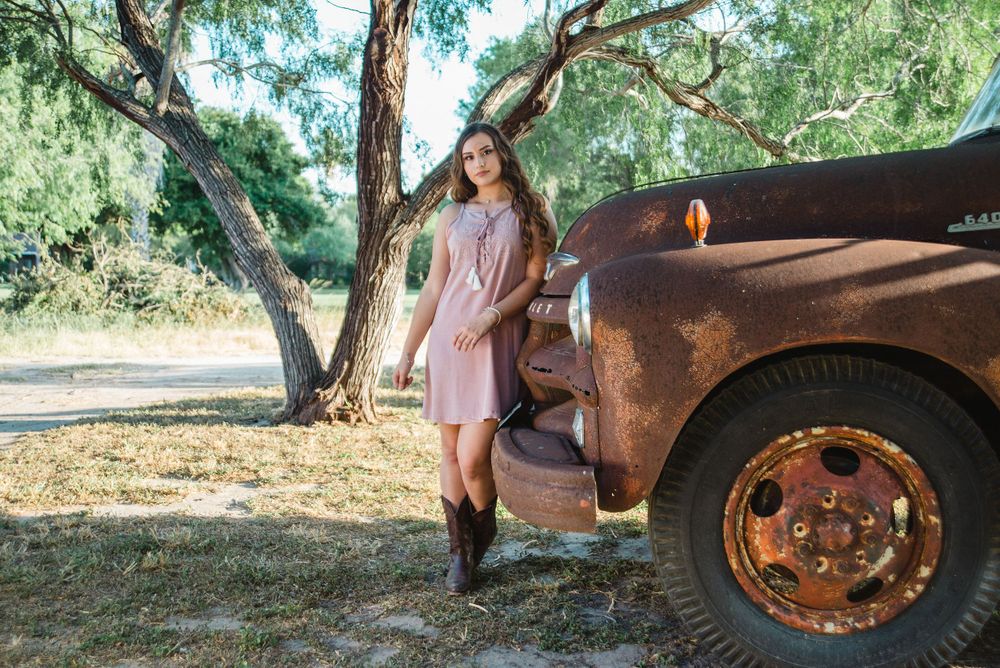 girl leaning on old truck. Memory lane photo spot. Mission, Texas. Wedding photography