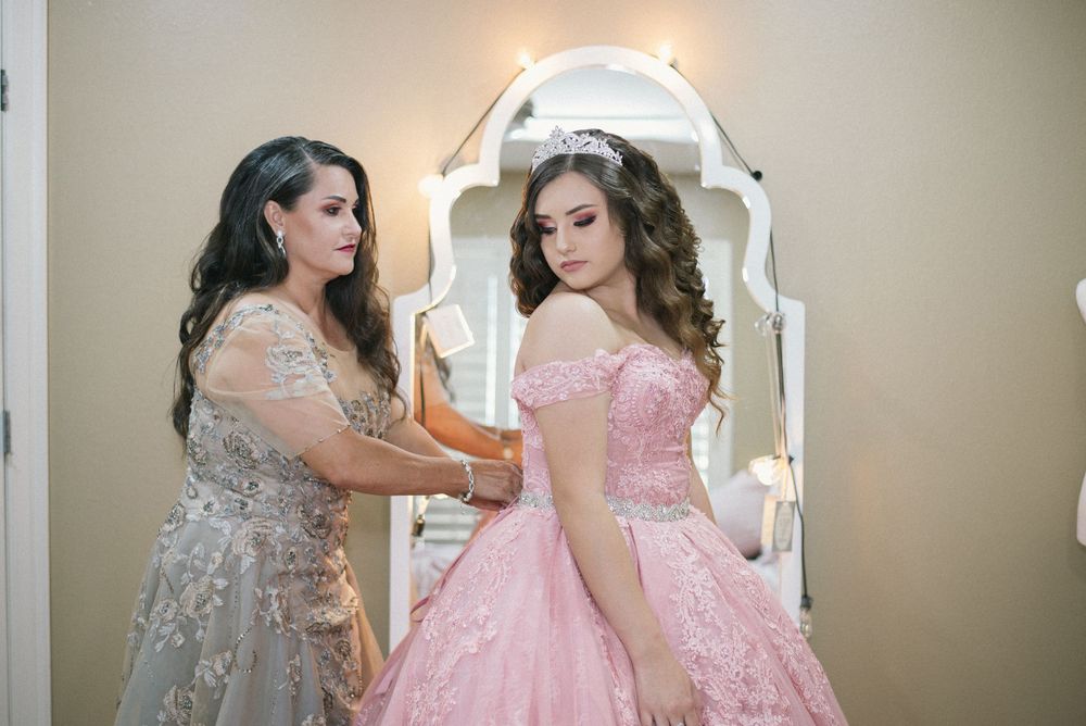 mother helping daughter get dressed. Corinthian Event Center. Mission, Texas. Wedding photography