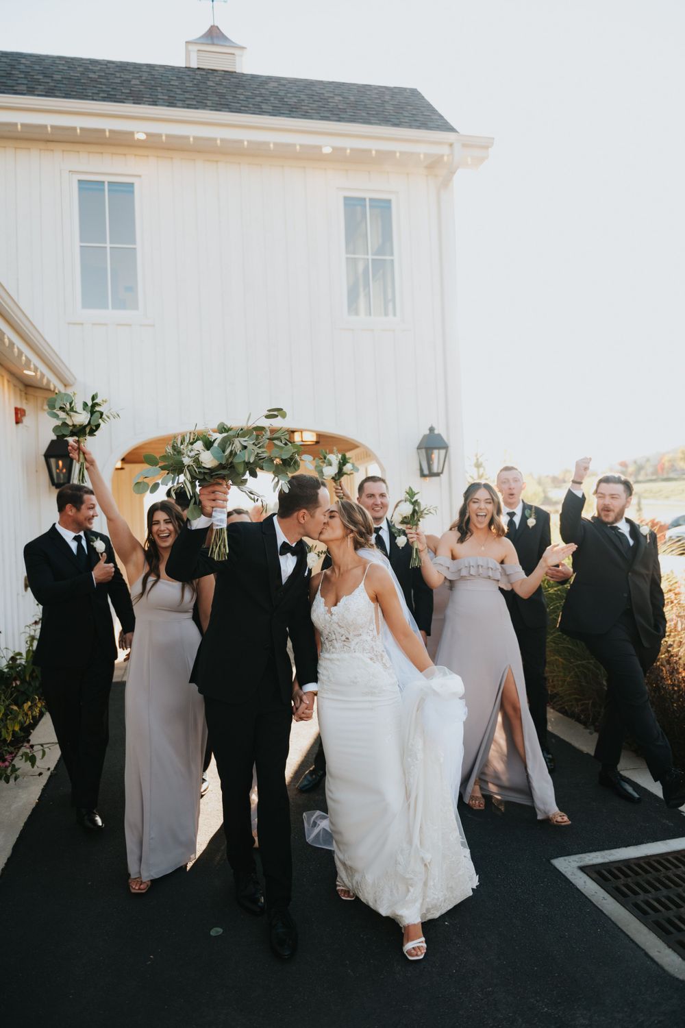 A bridal party celebrates a bride and groom at River Bottoms Ranch. Captured by Park City wedding photographer.