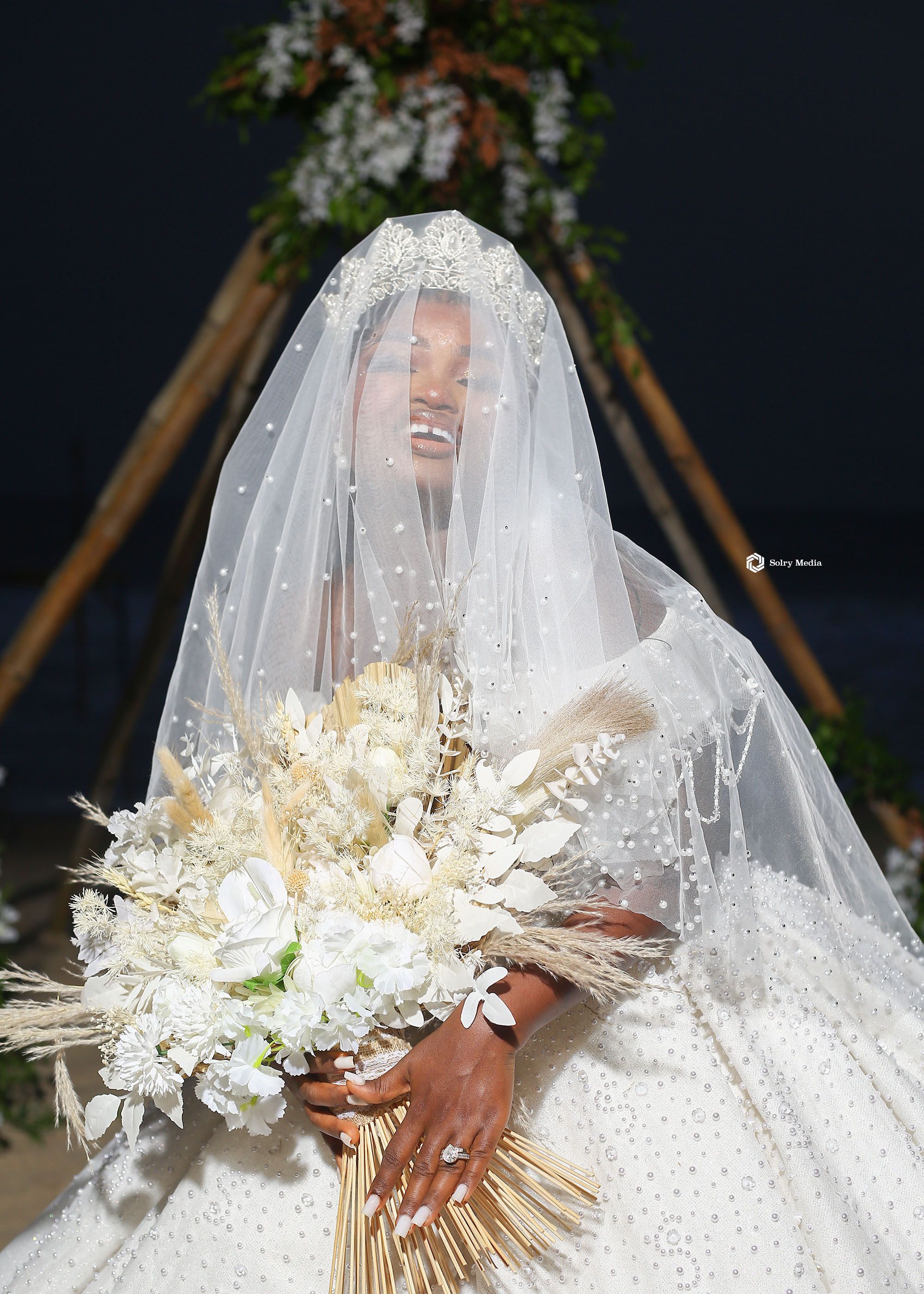Bride Covering her face with veil