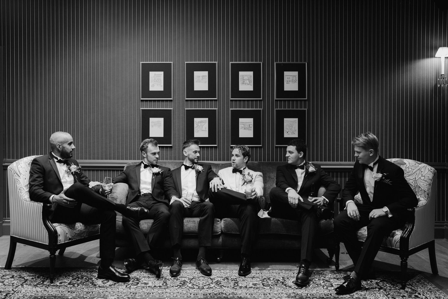 groom and groomsmen enjoying a drink at the Randolph hotel bar in oxford