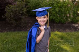 Kindergarten graduation portrait, blue cap and gown, preschool graduation