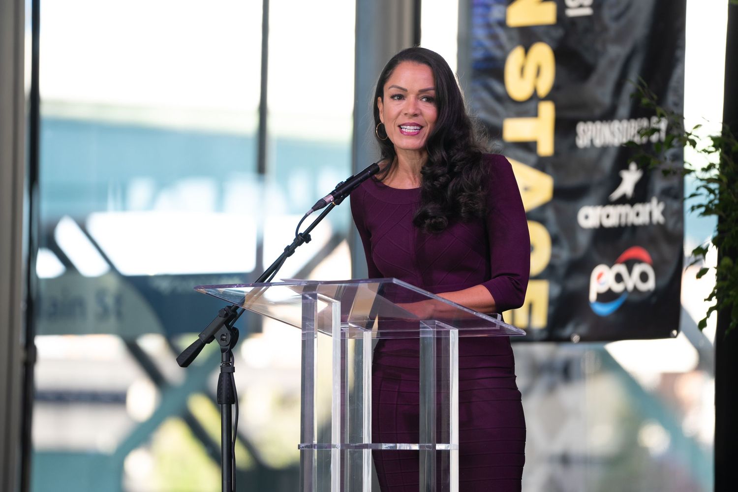 Newscaster introducing a keynote speaker at a business conference at Main St Station Richmond VA