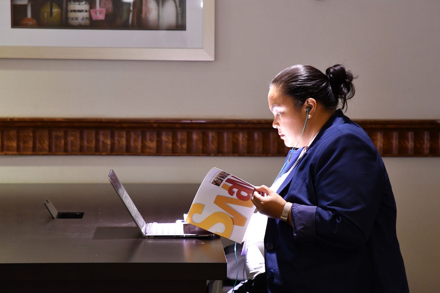 Corporate event attendee reviews the workshop schedule for the event