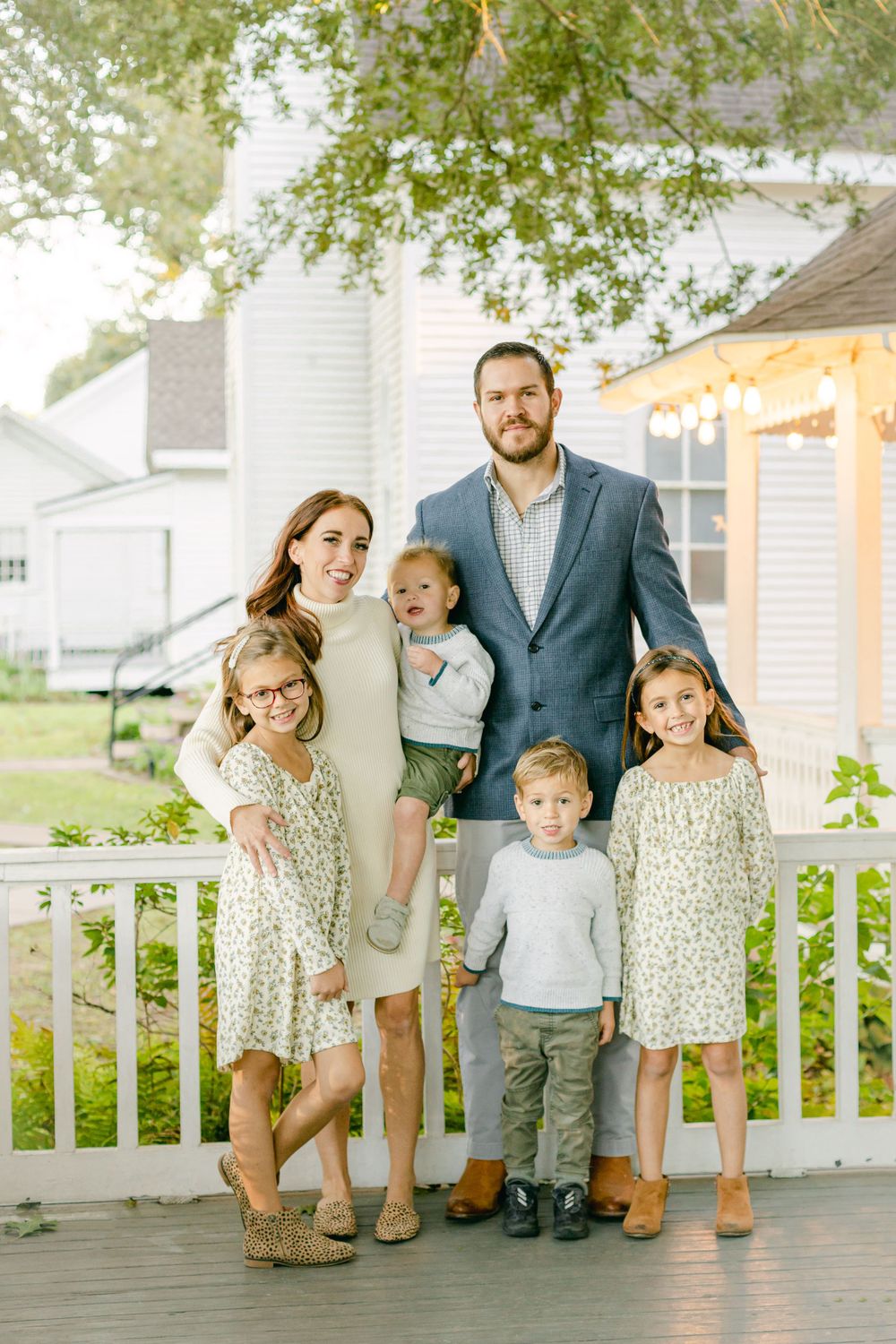 a family photo of mom, dad, and their four kids