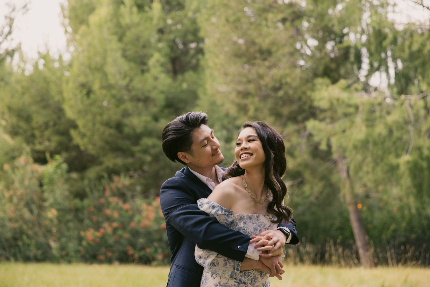 Romantic engagement photo session in a serene outdoor setting with natural lighting.